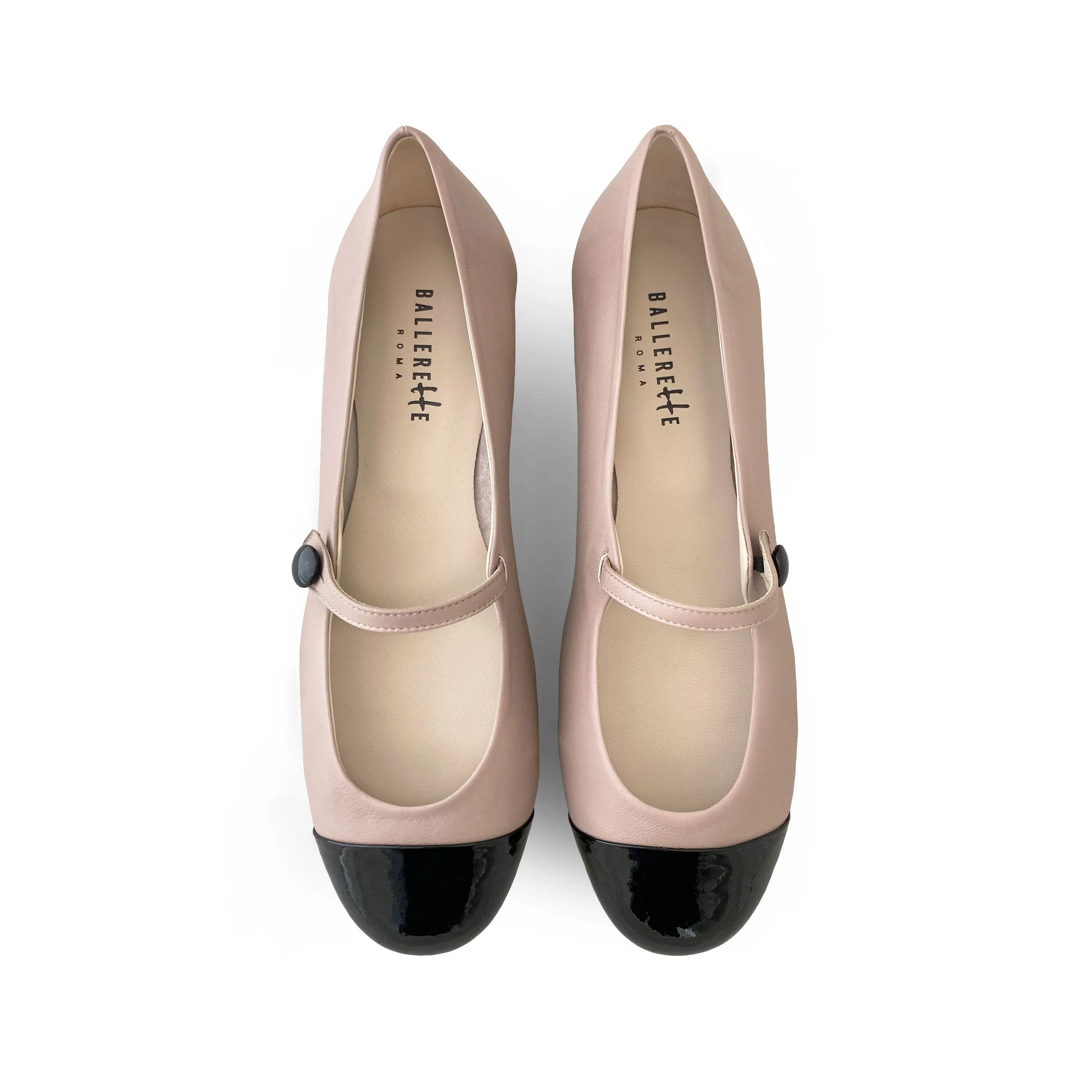 Powder pink ballet flats with black patent toe and strap