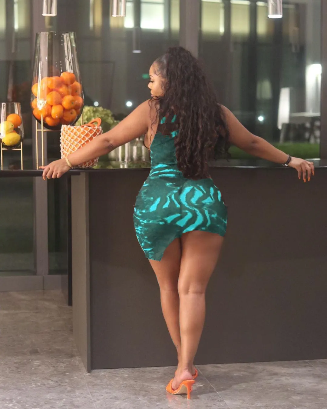 Sleek Printed Sleeveless Bodycon Dress with Eye-Catching Design