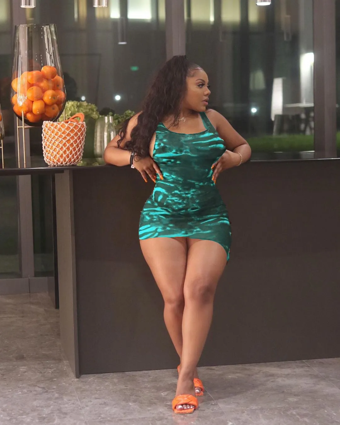 Sleek Printed Sleeveless Bodycon Dress with Eye-Catching Design